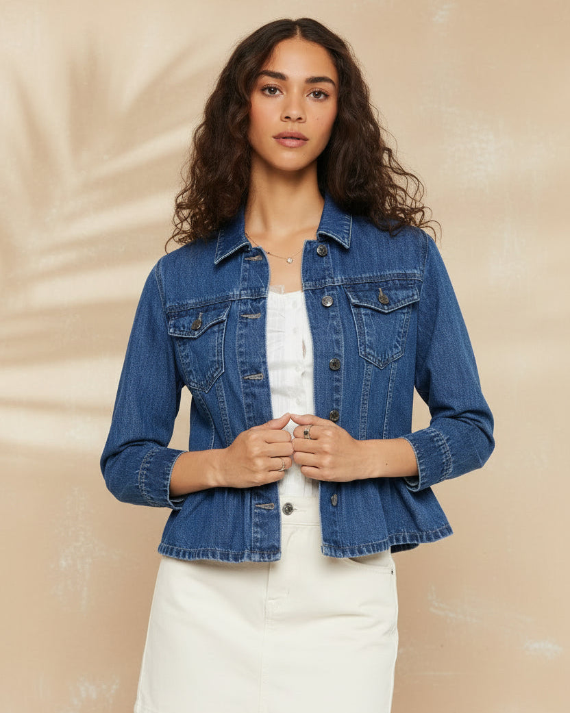 Woman wearing a blue denim jacket and beige skirt on a white background